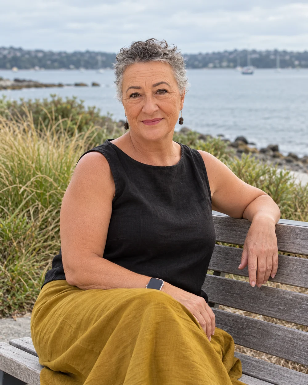 Robyn Haaker seated beside the harbour